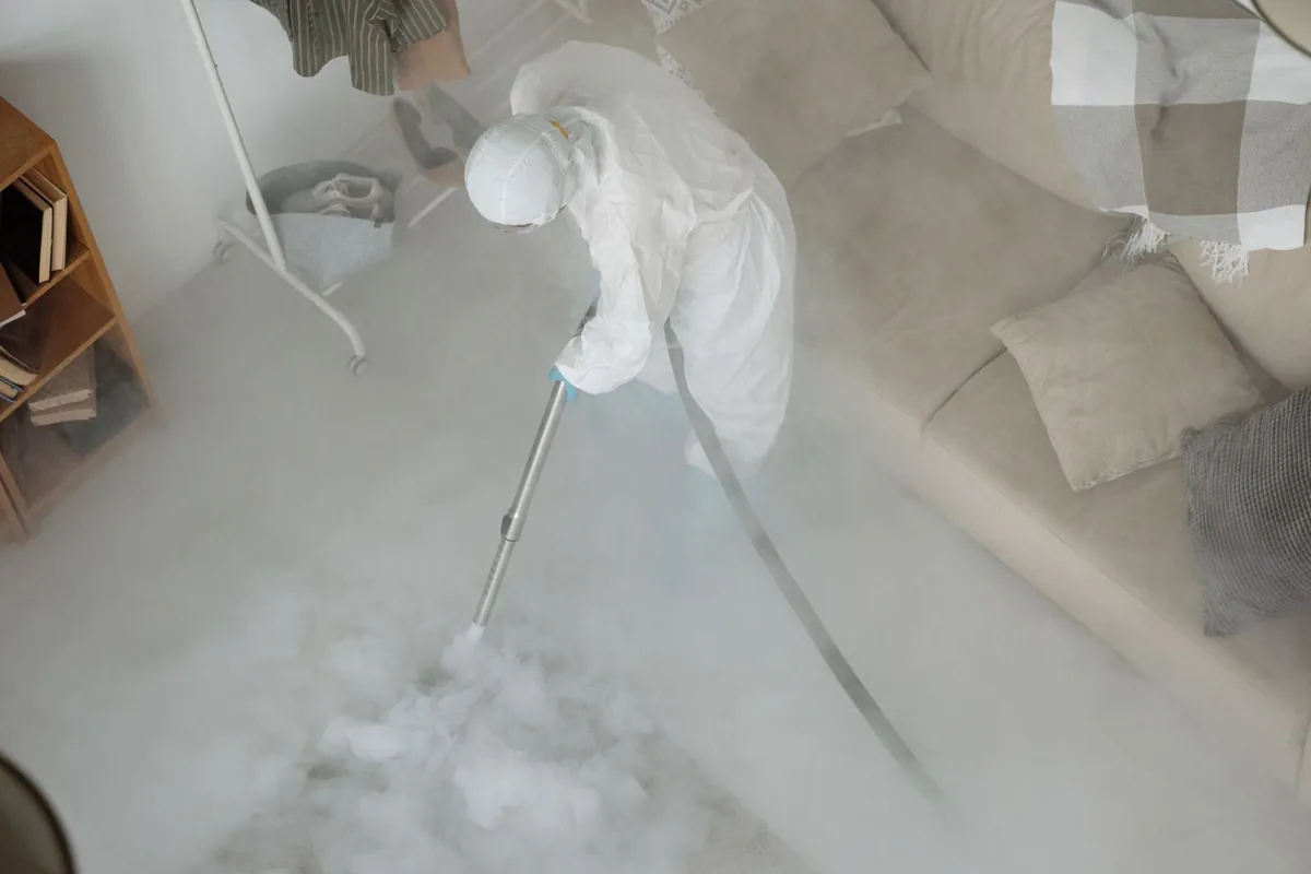 Biohazard cleanup technician in protective equipment, Guttenberg, IA